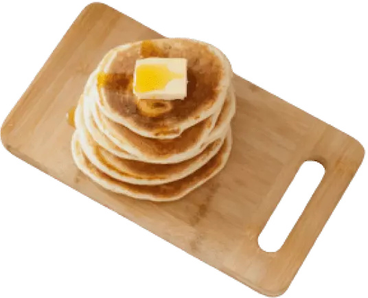 delicious pancakes on a wooden cutting board