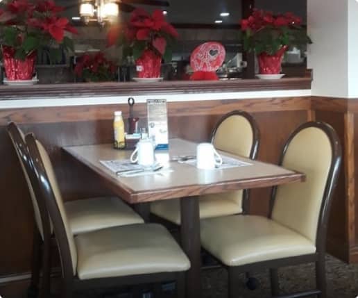 table and chairs inside the restaurant